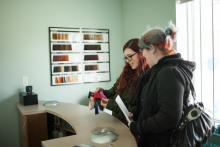 hairstyling students learning colour techniques and formulas in hair school brantford